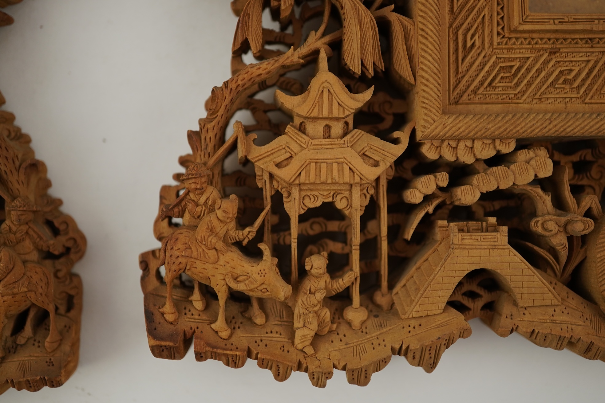 A pair of Chinese carved sandalwood frames, late 19th century